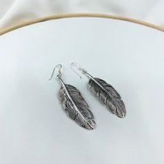 Feather Earrings, Sterling Silver, Feather Charms, Antique Silver, Bohemian Earrings, Boho, Gift for Her If you want to detail your orders or have something different in mind please contact me. --------------- * Material* >>  92.5% Silver ---------------   If you want more or another, please you click this link : https://etsy.me/2RKeiH4  ----------------------------------------------------------- All items packing with gifting box for you. -------------------------------------------------------- Bohemian Silver Feather Earrings, Silver Bohemian Feather Earrings, Adjustable Silver Feather Earrings, Adjustable Silver Earrings With Feathers, Feather Earrings Silver, Feather Charms, Silver Feather, Bohemian Earrings, Earrings Boho