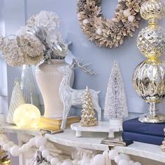 a mantle with christmas decorations and ornaments on it