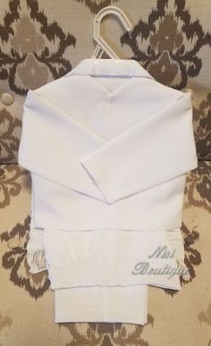 "White Color 6 pieces Baby Boy Christening Outfit It is perfect for baptism, blessing or any special occasion Comes with: -Shirt -Pants (The waist has elastic on the back for more comfort) -Sash (Is embroidered) -Tie -Suit jacket -Vest Measurements Size 9/12 mt pant's (waist 16\", long 17.5\" )shirt shoulder to shoulder ( 9\" ) shirt sleeve ( 10.5\" ) Size 12/18 mt pant's (waist 16\", long 18.5\" )shirt shoulder to shoulder ( 9.5\" ) shirt sleeve ( 11\" ) Size 2t pants (waist 17\", long 19\" ) s Classic Long Sleeve Sets For Baptism, Classic White First Communion Dress, Classic White Sets For Baptism, Classic White Set For Baptism, Elegant White Confirmation Sets, Baby Boy Christening Outfit, Boy Christening Outfit, Boy Baptism Outfit, Baby Boy Christening