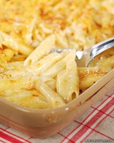 a casserole dish with macaroni and cheese in it, ready to be eaten