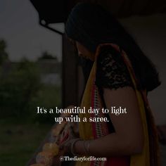 a woman in yellow and black dress holding an orange bag with the words it's a beautiful day to light up with a saree