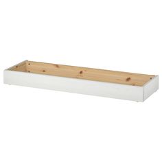 a white planter with wooden sides