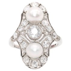 An Art Deco diamond, pearl, and white gold ring, comprising one large old European cut diamond, sixteen smaller old European cut diamonds, and six rose cut diamonds, set in 18 karat white gold, to a band of 18 karat white gold. This stunning Art Deco ring is set to the centre with a gorgeous old European cut diamond. The old European cut diamond, which is wonderfully sparkly, bright, white, and has good colour and clarity, is held within a millegrain edged bezel setting. The principal diamond ap Art Deco Geometric, Deco Ring, European Cut Diamonds, Art Deco Diamond, Ring Fit, Gorgeous Art, White Gold Ring, Art Deco Ring, Pearl Size