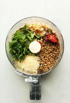 ingredients in a food processor ready to be blended into a smoothie or smoothie