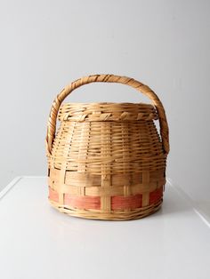 a woven basket sitting on top of a white counter