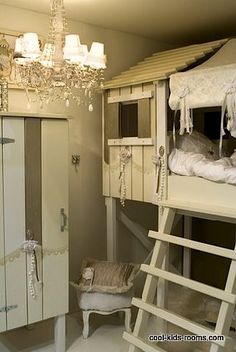 there is a bunk bed with a ladder next to it and other items in the room