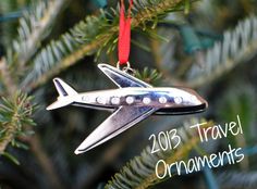 an ornament hanging from a christmas tree with the words 2013 travel ornaments on it