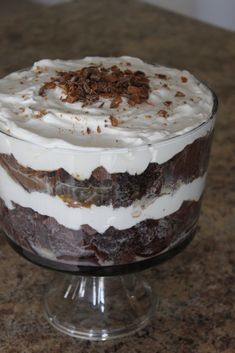 there is a cake in the glass dish on the counter