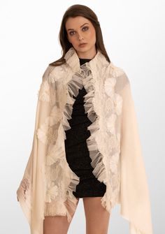 Indulge in the ultimate opulence with this ivory scarf woven from the finest cashmere. Wrap yourself in this statement piece elevated by its handcrafted tonal pearl-embroidered daisy flowers, exotic ivory lace panels and an ivory frill detailing on one side. This scarf brings with it a sense of timeless beauty, perfectly blending luxurious warmth and refined elegance. It is the ideal accessory to make heads turn on any formal evening out or a special occasion. Elegant Formal Shawl With Intricate Embroidery, White Silk Pashmina Shawl, Elegant Formal Embroidered Pashmina Shawl, Elegant Cream Embroidered Shawl, Embroidered Silk Scarves For Wedding, Luxury Cream Silk Scarf, Luxury Beige Scarf For Formal Occasions, Elegant Embroidered Wedding Scarf, Luxury Beige Formal Scarf