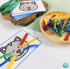 children's crafts and activities on a table with scissors, pencils and paper