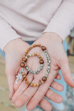 This beautiful gemstone rosary bracelet features wooden round beads as the paters in size medium and oval wooden bead in the size large (to add length) with Picture Jasper and Dalmation Jasper beads as the aves. Each of our stretch and wrap rosary bracelets is a full rosary. 

Each bracelet also includes a “bookmark”crucifix medal. This medal is moveable and can help you keep track of where you are at in your rosary as you pray throughout your day.

Each bracelet is strung on durable elastic making it easy to stretch and wrap around your wrist without fear of snapping it.