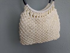 "Super cute, handmade purse in a chunky white crochet. This type of purse was a popular craft project in the 1960s and is a fine example of Mid Century fashion. This purse is very sturdy and will stand up well to daily use. Interior is lined with an off-white fabric. No interior pockets. This purse is large enough to comfortably hold today's essentials and a few extras. This purse is in great vintage condition - I'm sure it has ever been used. A few superficial scratches to the black plastic han Festival Crochet, Types Of Purses, Woven Purse, Macrame Purse, Mid Century Fashion, Handmade Handbag, Popular Crafts, Handmade Purse, Crochet Handbag