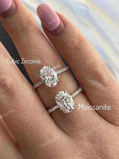 two engagement rings with diamonds on each finger