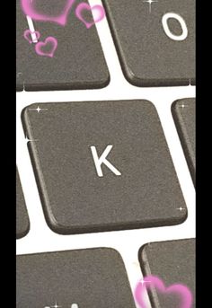 a keyboard with pink hearts on it and the letter k painted on it's keys