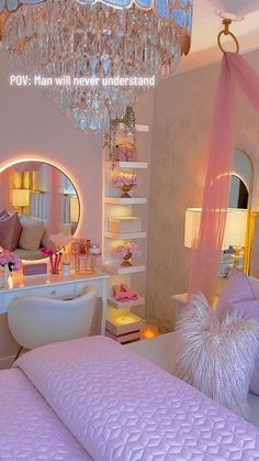 a bedroom with a chandelier hanging from the ceiling next to a pink bed