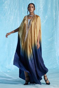 Multi-colored satin kaftan with a hand embroidered sequin collar and fringes. Comes with an inner.
Component: 2
Pattern: Embroidered
Type Of Work: Hand
Neckline: High Neck
Sleeve Type: Half
Fabric: Body : Satin (66% Viscose 34% Modal) + Sequin (100% Plastic), Lining : Satin (66% Viscose 34% Modal)
Color: Multi Color
Other Details: 
Embroidered neckline
Occasion: Cocktail - Aza Fashions Latest Kaftan Designs, Satin Kaftan, Kaftan Pattern, Sequin Collar, Kaftan Designs, Islamic Dress, Hand Body, Embroidered Neckline, Fashion App