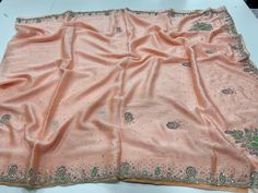 "Peach Crepe silk saree with cutdana Embroidery and stitched blouse. Blouse size is 32 and can be extended. Sleeve length 10\"." Bollywood Style Peach Blouse Piece With Zari Work, Traditional Pre-draped Peach Saree With Zari Work, Semi-stitched Peach Blouse Piece With Zari Work, Embroidered Peach Traditional Wear With Drape, Peach Semi-stitched Blouse Piece With Resham Embroidery, Semi-stitched Peach Blouse Piece With Resham Embroidery, Bollywood Style Peach Blouse With Resham Embroidery, Semi-stitched Blouse Piece With Pallu In Peach, Peach Blouse Piece With Cutdana Traditional Drape