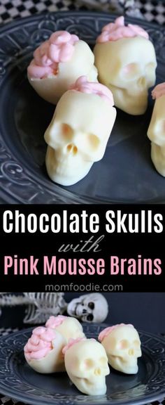 chocolate skulls with pink frosting on a black plate