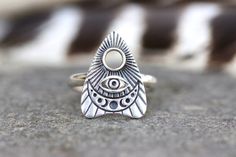 This listing is for one bold and mesmerizing sterling silver celestial planchette ring that is elegant and edgy and unique! The planchette is beautifully detailed with moon phases, an All Seeing Eye, and radiant lines. These sturdy and solid statement rings make a great gift for any witchy woman (or man!) - Choose your ring size at checkout! - Planchette measures 19mm by 15mm.- Ring band is made from sturdy 9 gauge half round sterling silver wire.- Made to Order. Please check current processing Silver Celestial Jewelry For Festivals, Mystical Engraved Silver Rings, Celestial Silver Jewelry For Festivals, Bohemian Moon Phase Open Ring Jewelry, Bohemian Open Ring With Moon Phase Detail, Mystical Sterling Silver Ring Jewelry, Mystical Sterling Silver Jewelry Ring, Sterling Silver Celestial Jewelry For Festivals, Sterling Silver Mystical Ring Jewelry