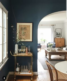 a living room with blue walls and furniture