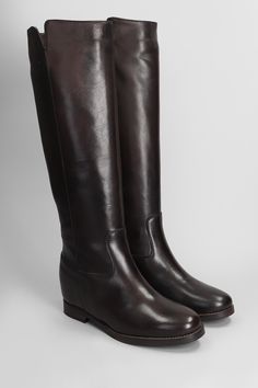 low heels boots in dark brown leather, round toe, slip on, stitching detail, inside wedge height 50mm, leather sole, 100% leather, Made in Italy Classic Brown Knee-high Riding Boots, Classic Brown Knee-high Boots For Riding, Classic Brown Heeled Boots, Brown Wedge Boots With Leather Sole And Round Toe, Leather Knee-high Wedge Boots For Work, Formal Brown Knee-high Boots With Leather Sole, Brown Leather Wedge Boots With Leather Sole, Classic Brown Heeled Boots For Work, Classic Brown Knee-high Boots For Office