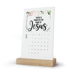 a desk calendar with the words, there is power in the name of jesus on it