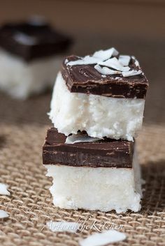 three pieces of chocolate and marshmallow ice cream stacked on top of each other