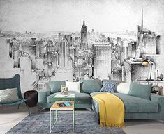 a living room filled with furniture and a wall mural