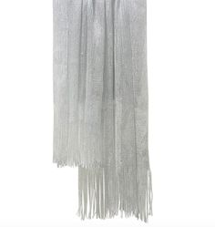 Size: 50 x 210cm (Approximately)      Material: 100% Viscose     Metallic Thread     Scarf / Shawl     Elegant, Woven Design      Tassel Side     Perfect Style for Occasion / Wedding Wear  Color: Silver  Elevate your look with this stylish and versatile grey knit shawl/wrap. Perfect for any occasion, this rectangle scarf is made of high-quality viscose fabric and features tasselled accents for added flair. Measuring 210cm in length and 50cm in width, it can be worn in a variety of ways to comple Semi-stitched Silver Pre-draped Saree For Festivals, Metallic Scarf, Metallic Shawl Silver, Tassel Scarf, Viscose Fabric, Metallic Thread, Knitted Shawls, Wedding Wear, Everyday Wardrobe