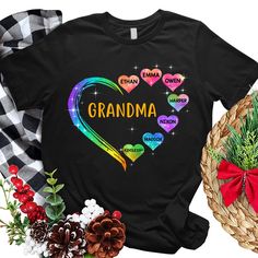 a t - shirt that says grandma with hearts and rainbows on the front, surrounded by other items