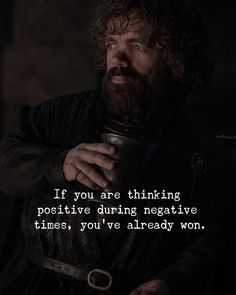 a man holding a cup in his hand with a quote from game of throne on it