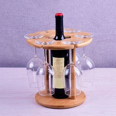 a wine bottle holder with six wine glasses