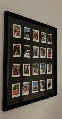 a black framed photo hanging on the wall