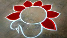 a red and white flower is drawn on the ground