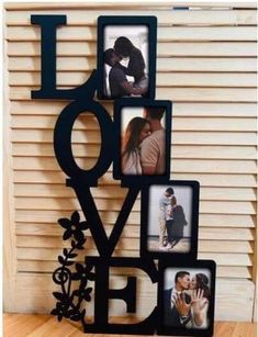 a black love frame with four photos on it