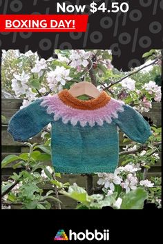 a knitted sweater hanging from a tree branch with the words, dream flower - hobbi plus opskitit