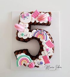 the number five is made out of chocolate and decorated with icing