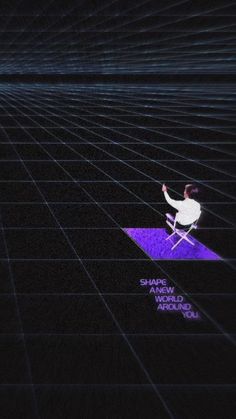 a man sitting on top of a chair in the middle of a room with purple lights