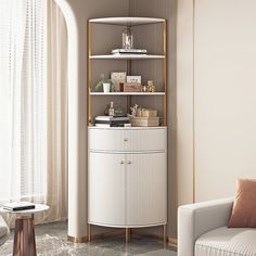 a living room with a white couch and a tall shelf in the corner next to a window