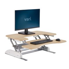 a computer desk with a monitor, keyboard and mouse on it in front of a white background