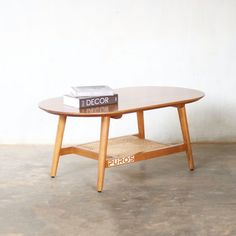 a coffee table with two books on top