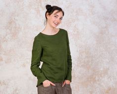 "You don't have a forest green blouse yet, it's time to buy it. This is my favorite color this fall. It is a middleweight linen top, not attached to the body. Casual linen long sleeve shirt can be made from 35 different linen colors, so if the green is not your color, you will definitely find yours. ----------------------------------------------------------------------------------------- MATERIAL: 100% High-quality European linen fabric. - washed, softened - middleweight linen; - doesn't shrink Dark Green Tops For Fall, Linen Crew Neck Blouse For Fall, Casual Long Sleeve Dark Green Tops, Olive Long Sleeve Tops For Winter, Casual Dark Green Long Sleeve Tops, Long Sleeve Linen Top For Winter, Spring Dark Green Long Sleeve Tops, Spring Long Sleeve Dark Green Tops, Spring Casual Dark Green Long Sleeve Tops