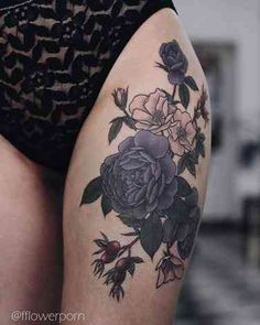 a woman's thigh with flowers on it