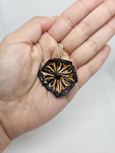 I made this piece out of polymer clay and sterling coated silver chain. A pendant necklace based on monarch butterfly colors and sun shape.  Chain lenght is 18 inches( lays close to collar bone) The pendant is 3cm height and lenght and 3mm in depth and lightweight.this is a small light weight and dainty necklace. Hand Painted Black Polymer Clay Jewelry, Black Hand Painted Pendant Jewelry, Hand Painted Black Pendant Jewelry, Black Polymer Clay Jewelry Gift, Orange Polymer Clay Jewelry As A Gift, Hand Painted Orange Necklace For Gifts, Hand Painted Orange Necklace For Gift, Hand Painted Orange Jewelry For Gifts, Orange Hand Painted Necklace For Gift