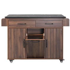 a kitchen island with black granite top and drawers on casteors, in front of a white background