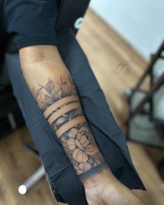 a person with a flower tattoo on their arm