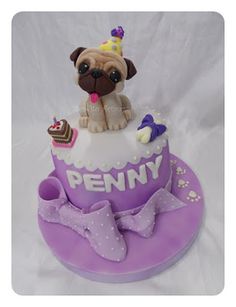 a birthday cake with a pug on top