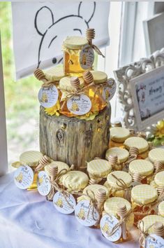 a table topped with lots of cookies covered in honey