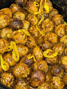 meatballs and peppers are cooked in the slow cooker to make them look delicious