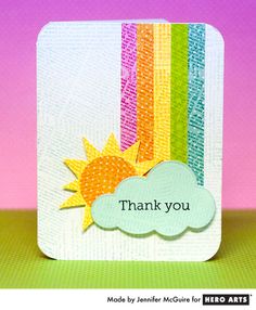 a card with the words thank you written on it and a rainbow in the background